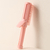 Retractable curling comb