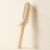 Retractable curling comb