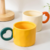 Ceramic cup with a heart - shaped handle