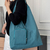 Large-capacity triangular pouch handbag
